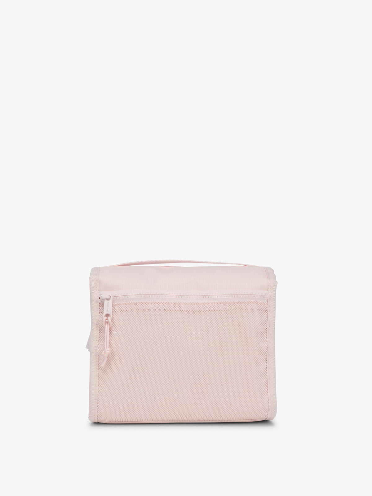 Backside of CALPAK Terra Hanging Toiletry Bag in light pink Shell Pink with front buckle; THY2201-SHELL-PINK