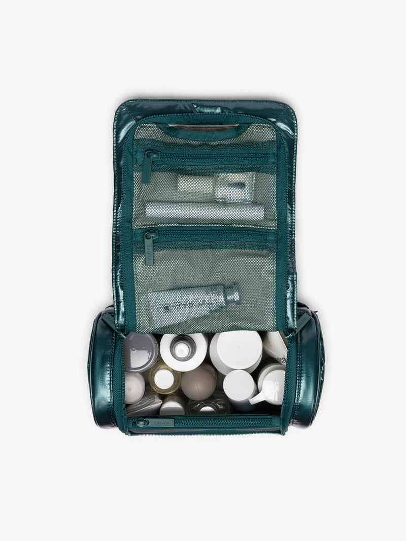 Toiletries in CALPAK Luka Hanging Toiletry Bag in dark green shiny Kale
