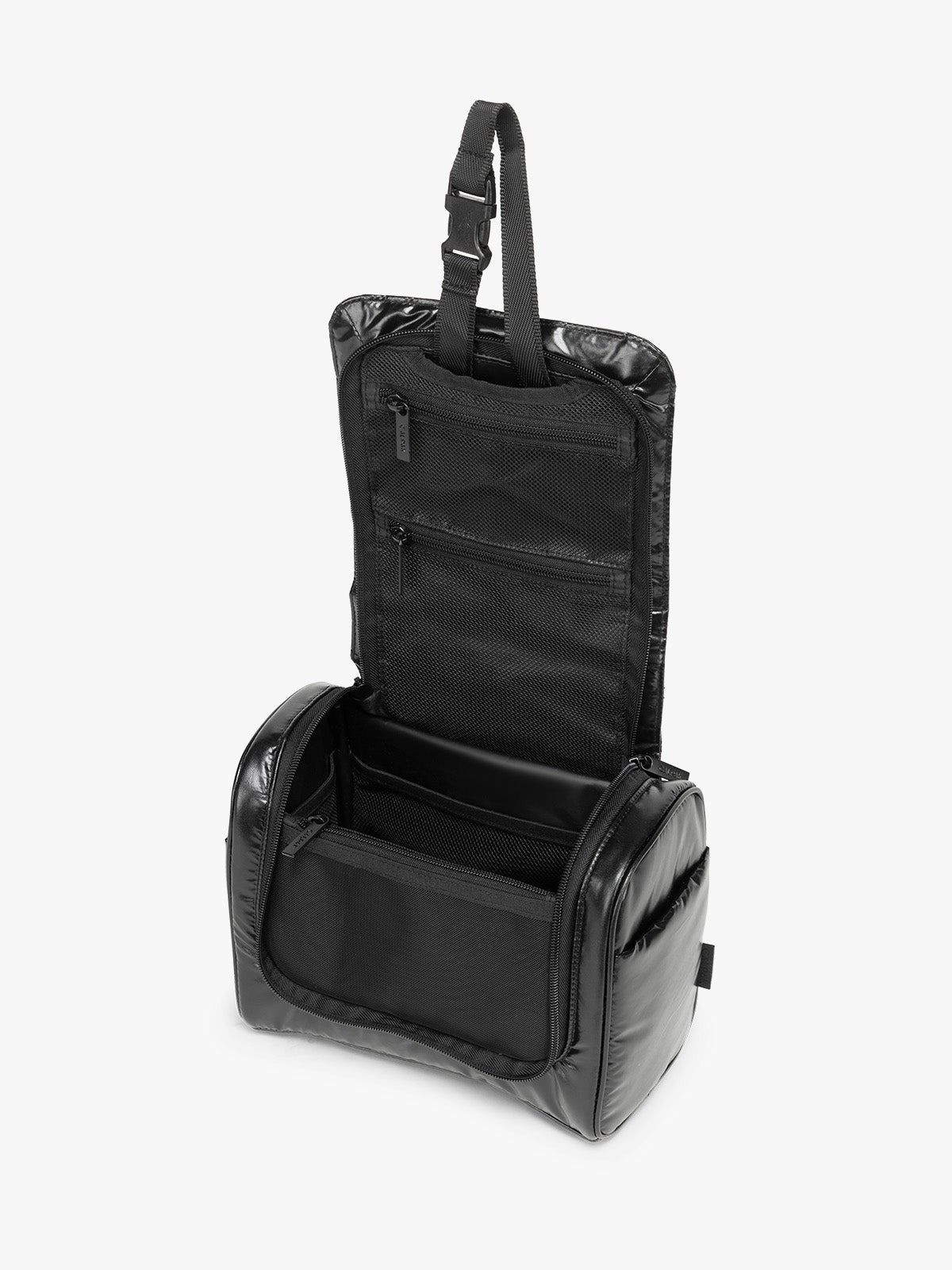 Opened view of CALPAK Luka Hanging Toiletry Bag in Glazed Black; TLH2301-GLAZED-BLACK