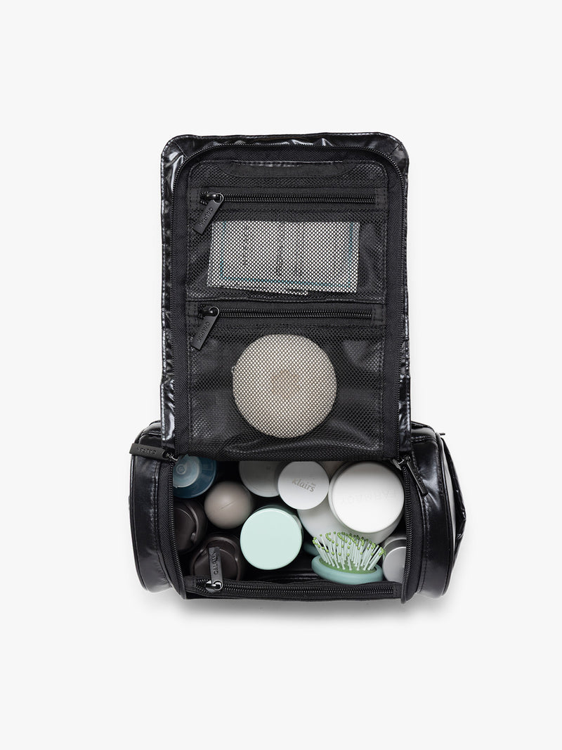Opened CALPAK Luka Hanging Toiletry Bag in Glazed Black