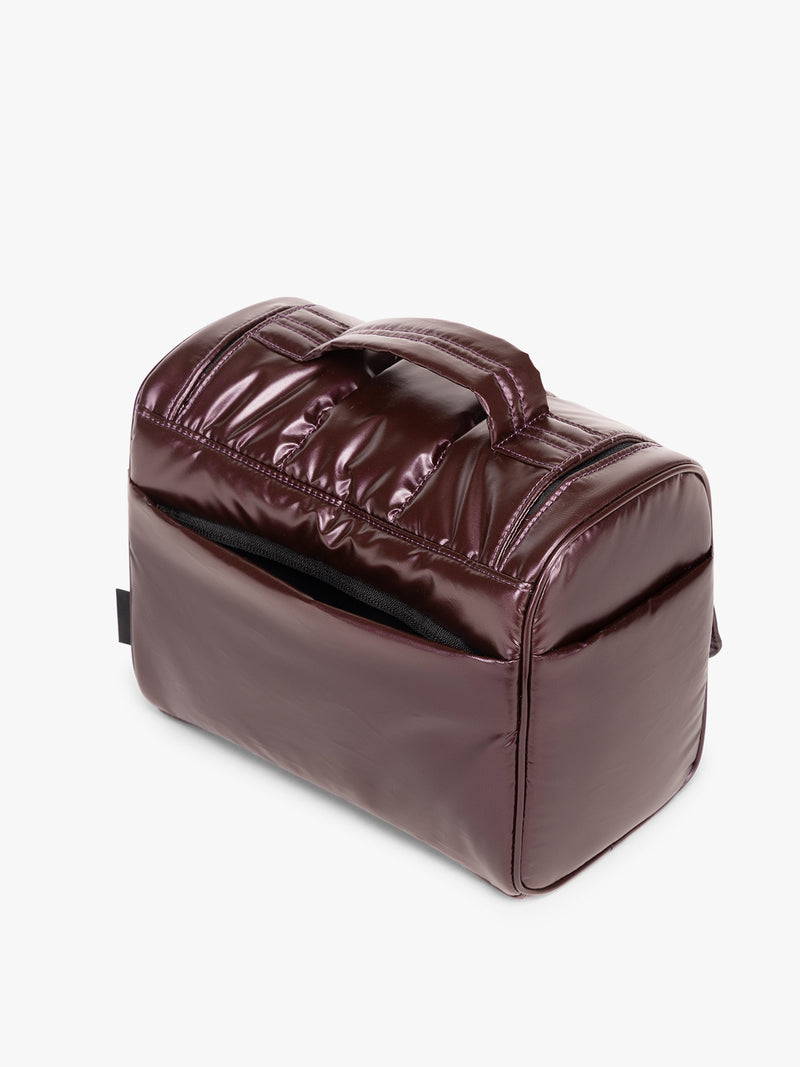 Back view of CALPAK Luka Hanging Toiletry Bag in maroon Glazed Dark Cherry
