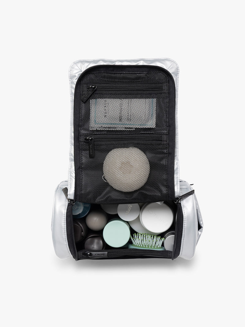 Items in the CALPAK Luka Hanging Toiletry Bag in Silver