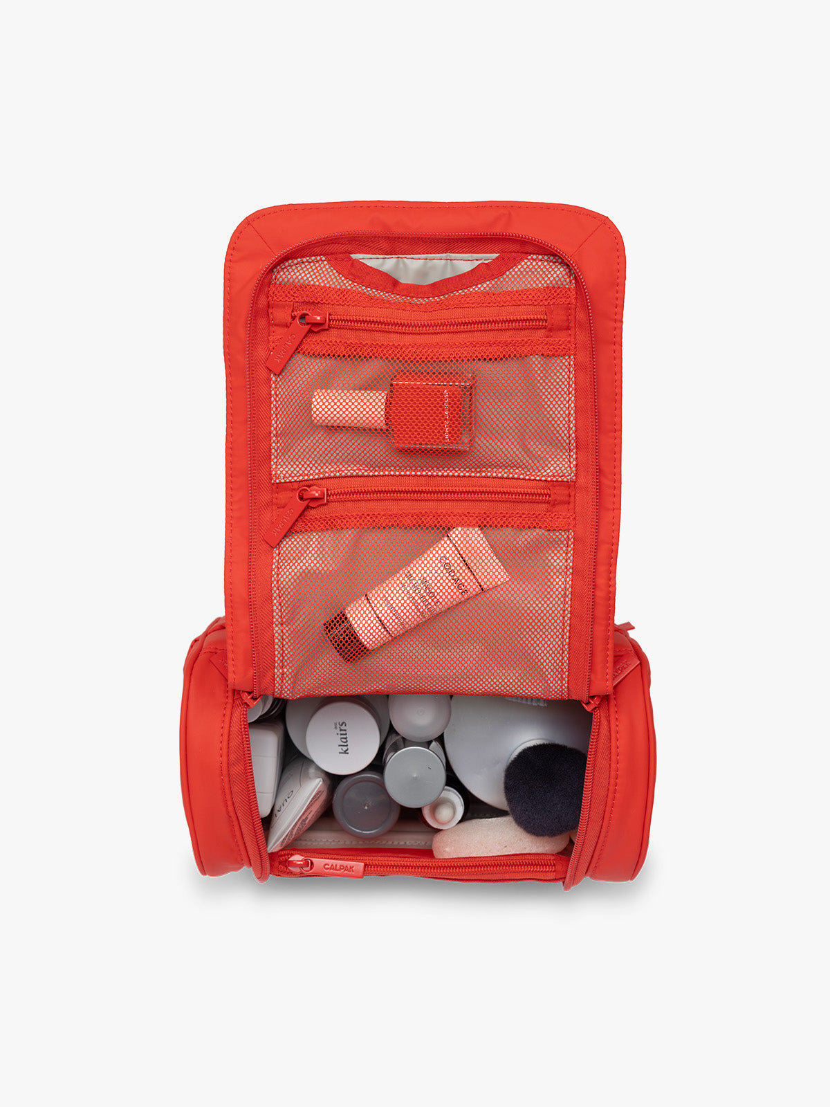 Toiletries in CALPAK Luka Hanging Toiletry Bag in red Tomato; TLH2301-TOMATO