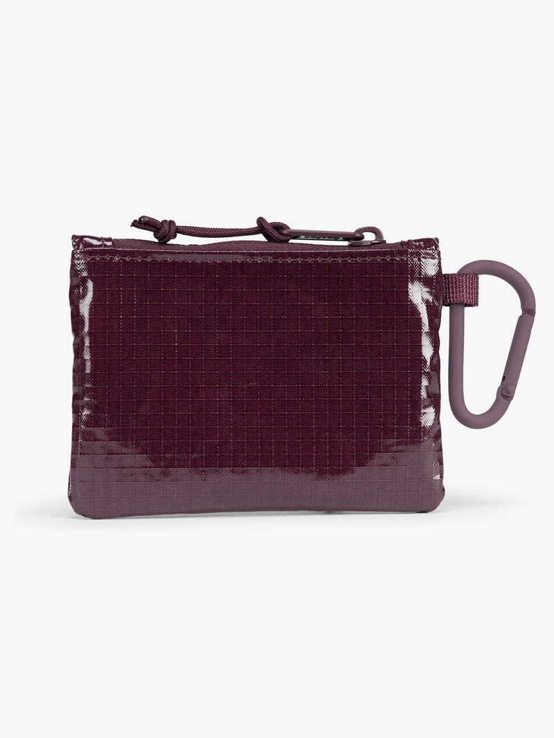 Backside of dark red Dark Cherry CALPAK Terra Clippable Card Pouch with carabiner clip and zipper on a white background