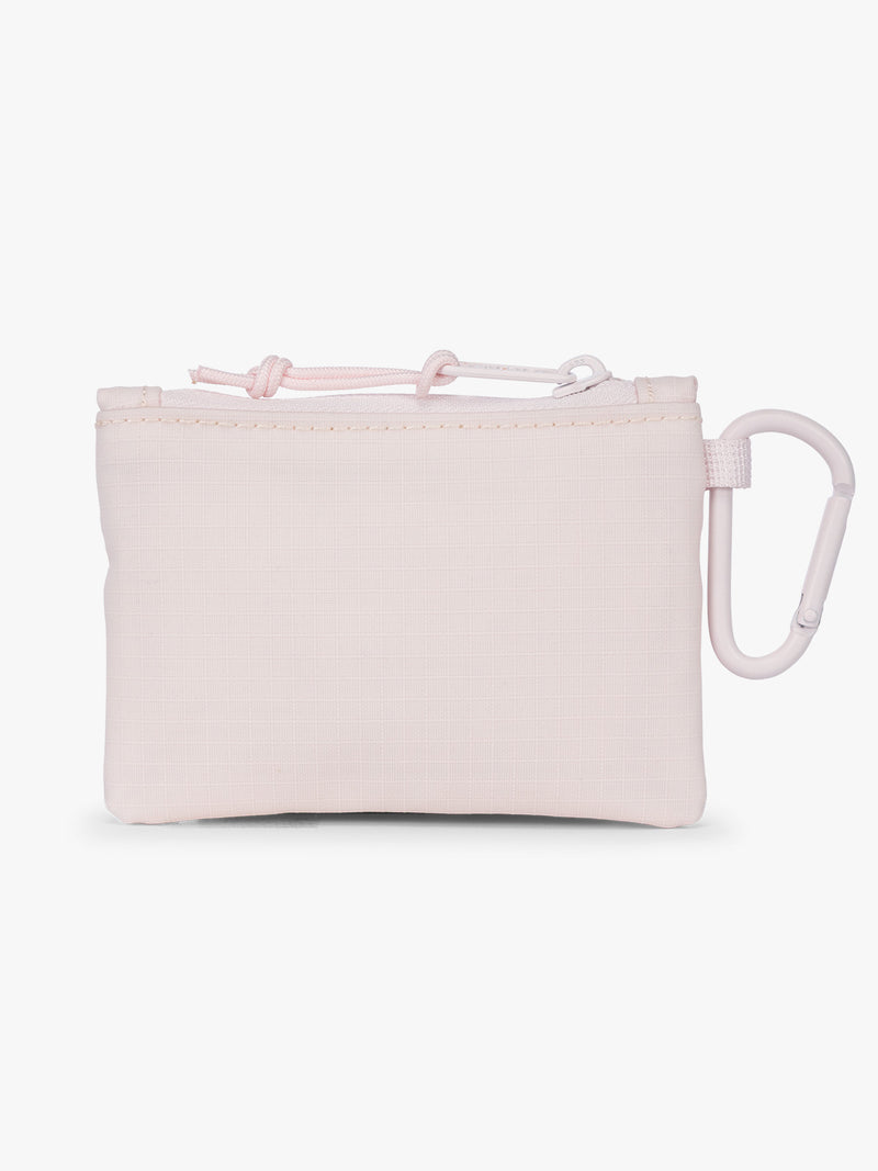 Backside of CALPAK Terra Clippable Card Pouch in shiny pink Shell Pink on a white background with a carabiner