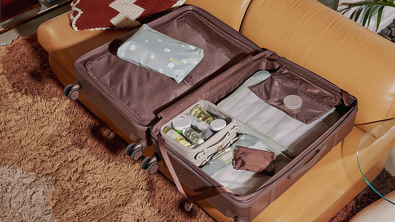 CALPAK Trnk Large Luggage in brown Espresso opened with items inside