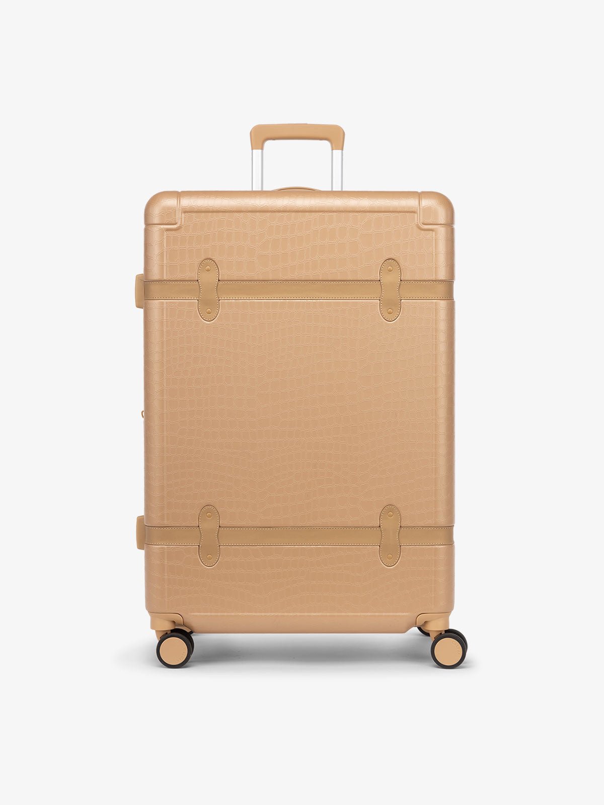 large 29 inch beige almond hard shell CALPAK TRNK suitcase with four 360 wheels in vintage trunk style