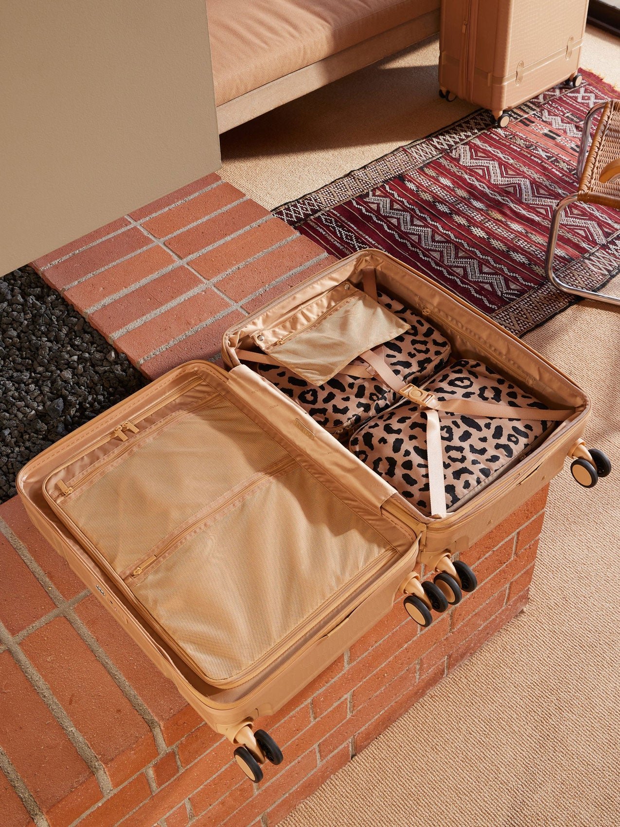 CALPAK TRNK almond 25 inch medium size luggage with compression straps