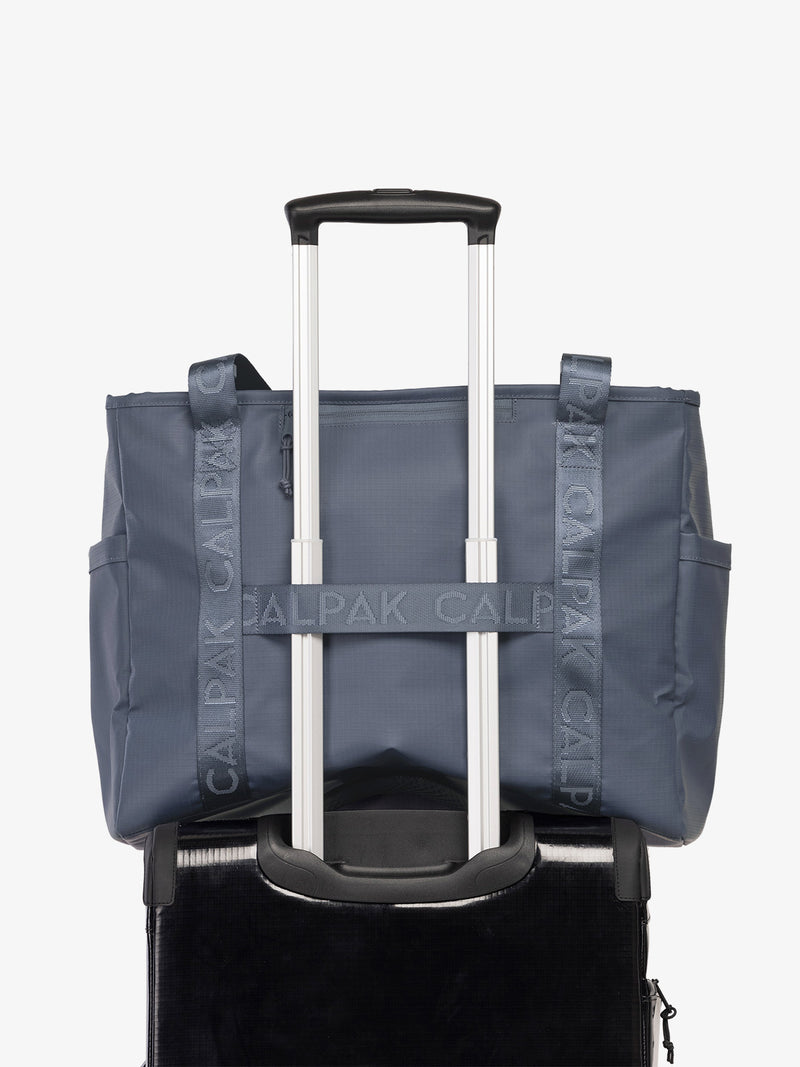best travel tote bag with trolley sleeve Terra 35L Water Resistant Zip Tote Bag in Indigo