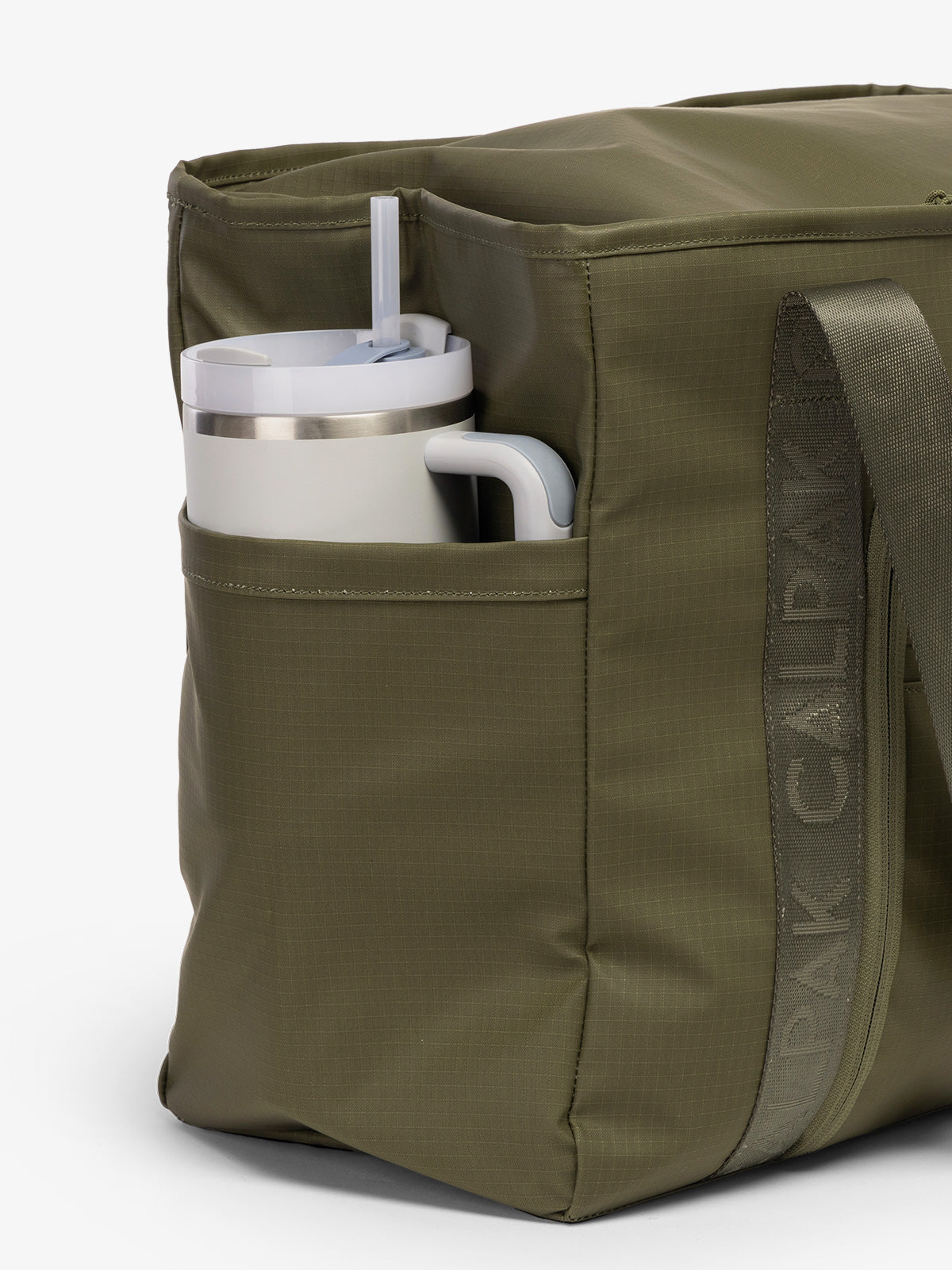 CALPAK Terra 35L Water Resistant Zippered Tote Bag in dark green Matte Pine side pocket used as as water bottle holder; TTO2401-PINE