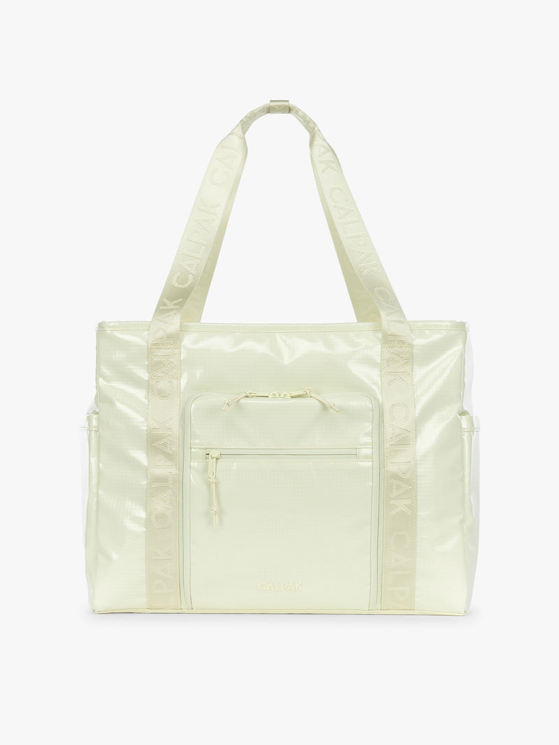 CALPAK Terra 35L Tote Bag with multiple pockets and shoulder straps in shiny light green Celadon on a white background