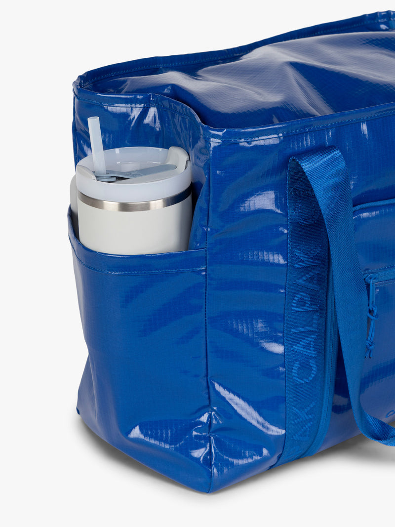 CALPAK Terra 35L Tote in blue Cobalt water bottle holder