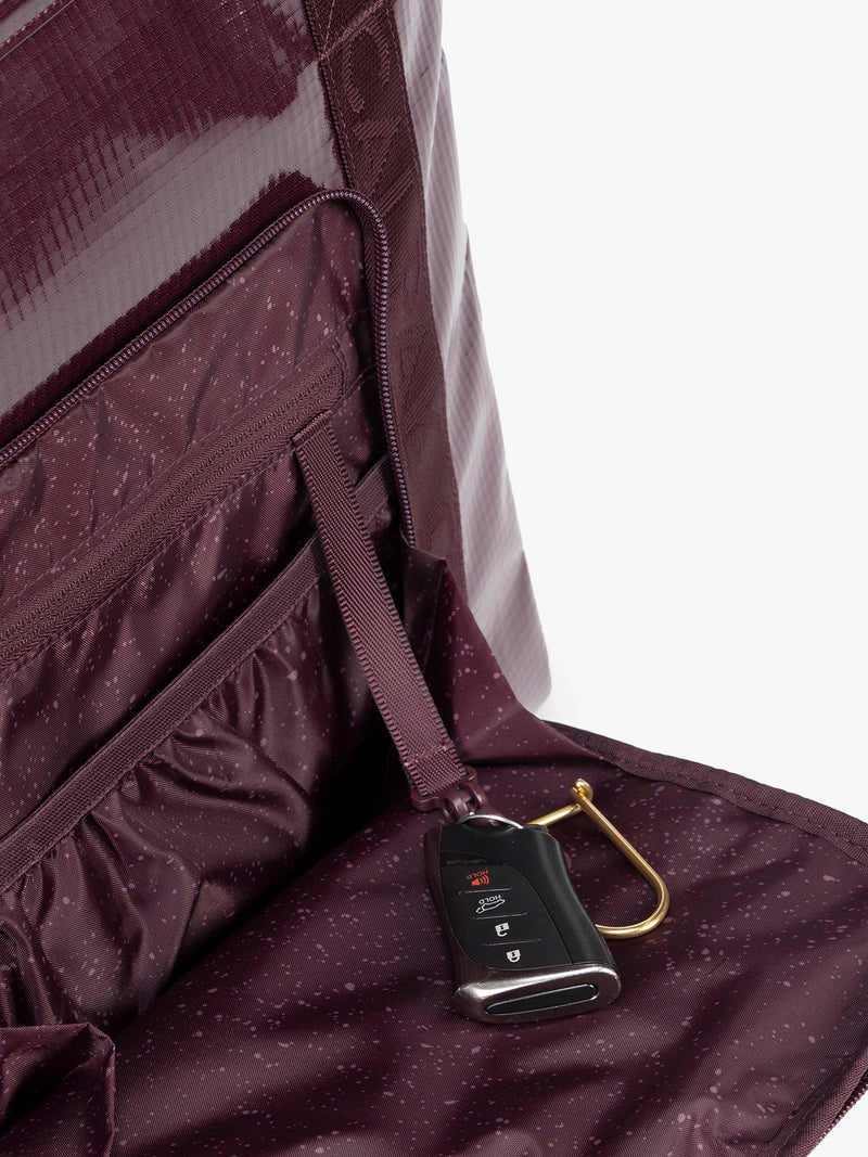 Key line of CALPAK Terra 35L Tote Bag with zippers in dark red Dark Cherry on a white background