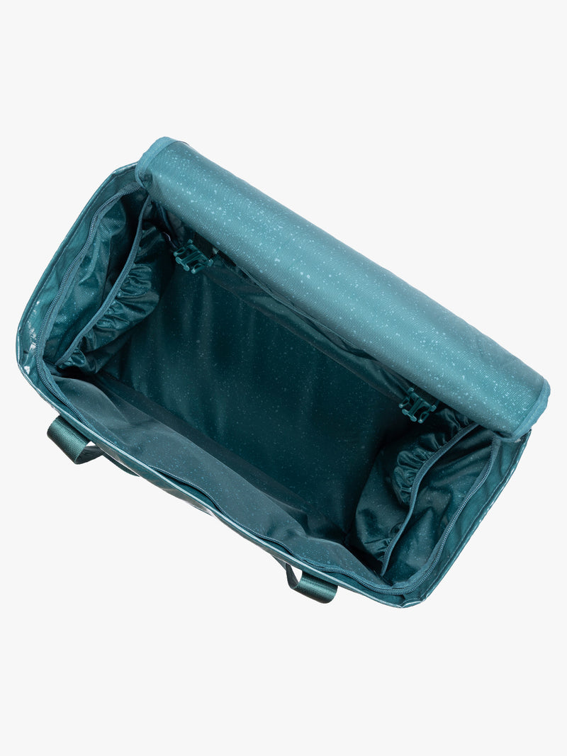 Opened CALPAK Terra 35L Tote Bag with zippers in blue green Kale on a white background
