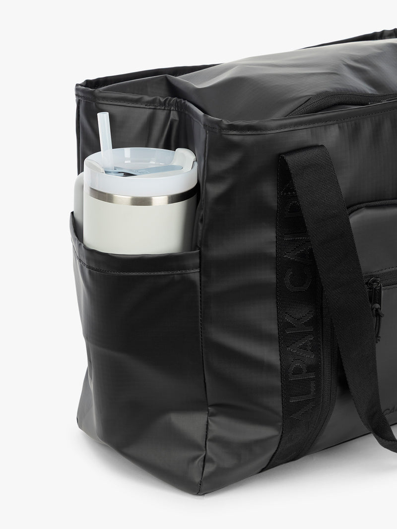 CALPAK Terra 35L Tote in black Matte Obsidian side pocket for water bottle