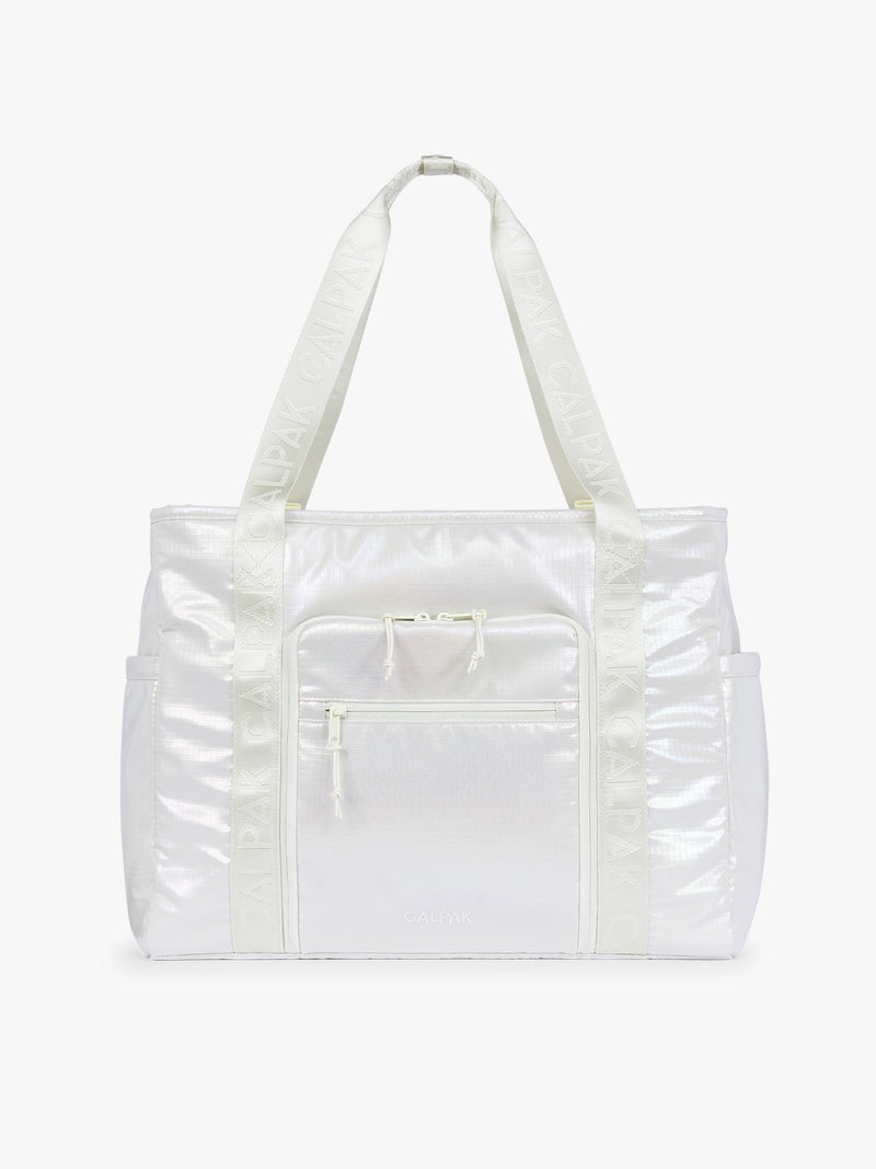 CALPAK Terra 35L Tote Bag with multiple pockets and shoulder straps in shiny white Moonbeam on a white background