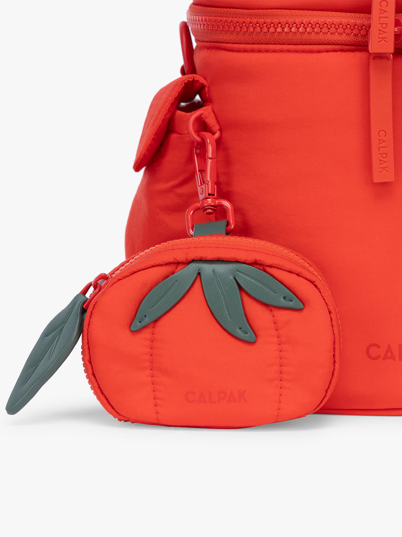 CALPAK Tomato Zip Bag Charm with green leaf zipper and red clip on bag