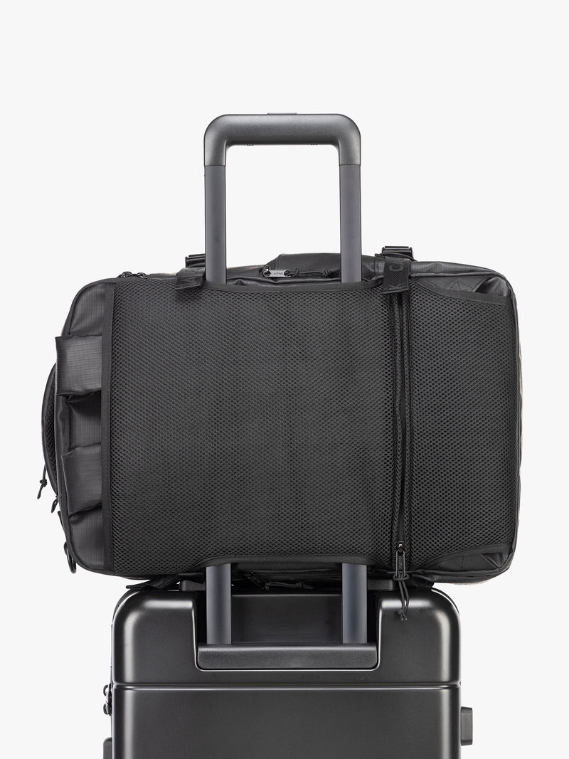 CALPAK Terra 26L Laptop Duffel Backpack in black Matte Obsidian trolley sleeve view