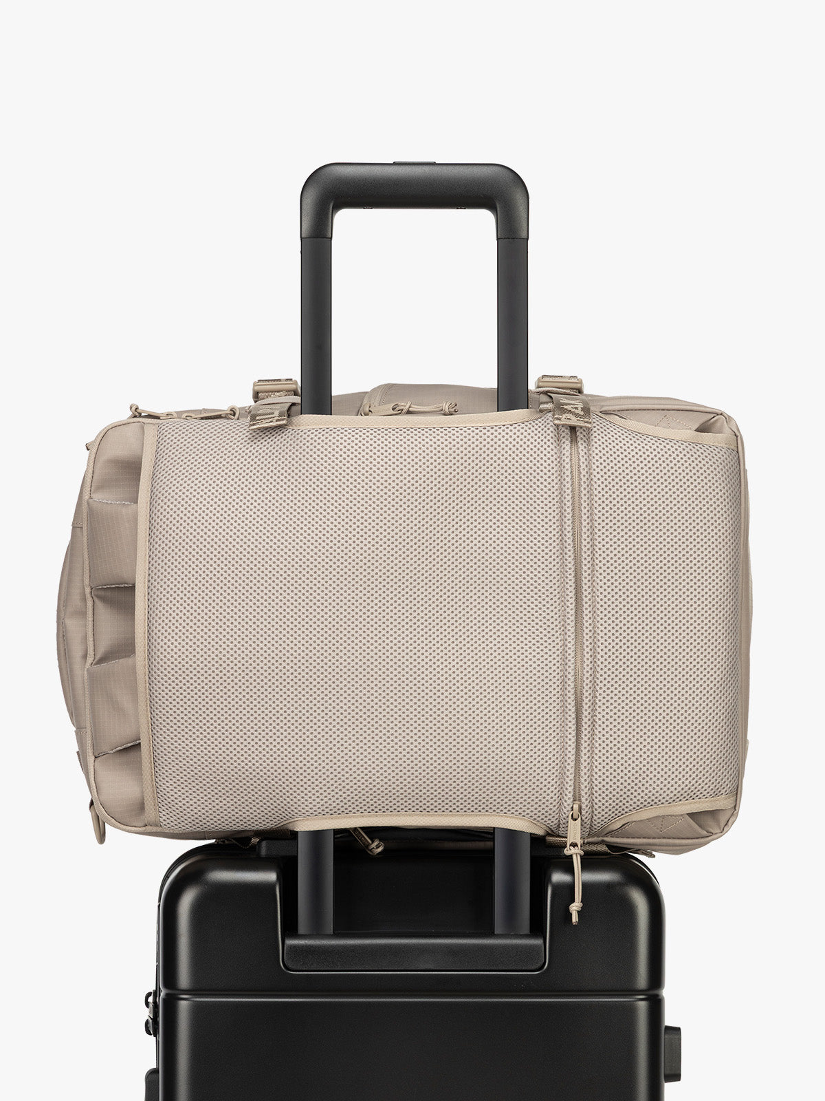 CALPAK Terra 26L Laptop Duffel Backpack in beige Stone trolley sleeve view; BPH2201-STONE