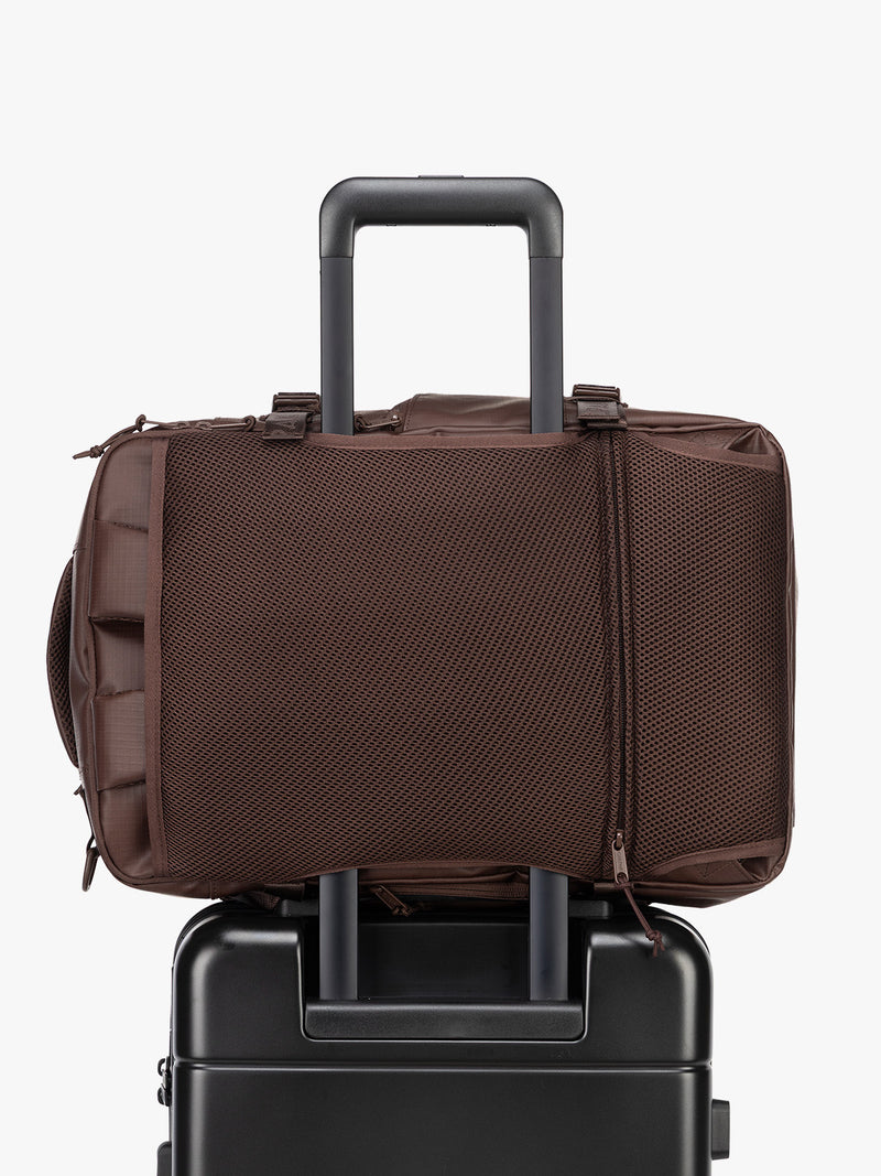 CALPAK Terra 26L Laptop Duffel Backpack in brown Walnut trolley sleeve view