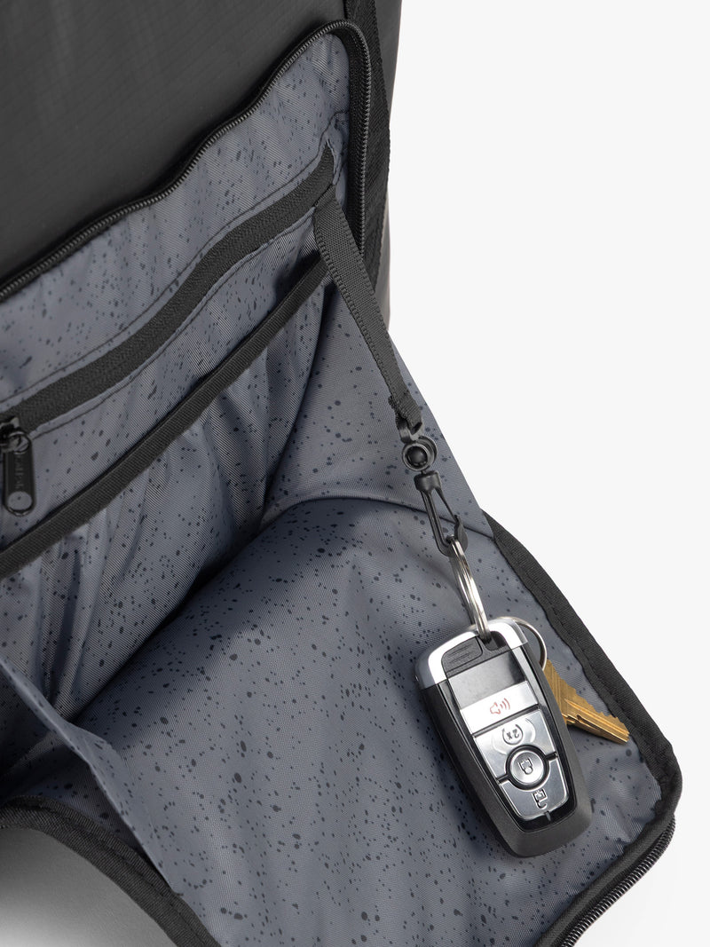 CALPAK Terra 35L Tote in black Matte Obsidian side pocket key string