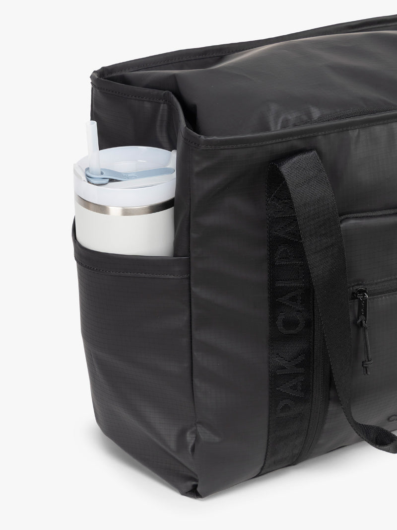 CALPAK Terra 35L Tote in black Matte Obsidian side pocket water bottle