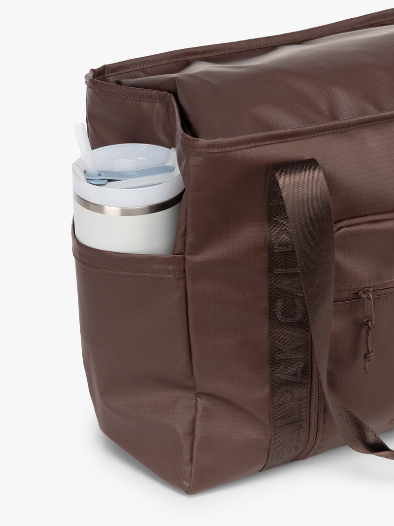 CALPAK Terra 35L Tote in brown Walnut side water bottle pocket