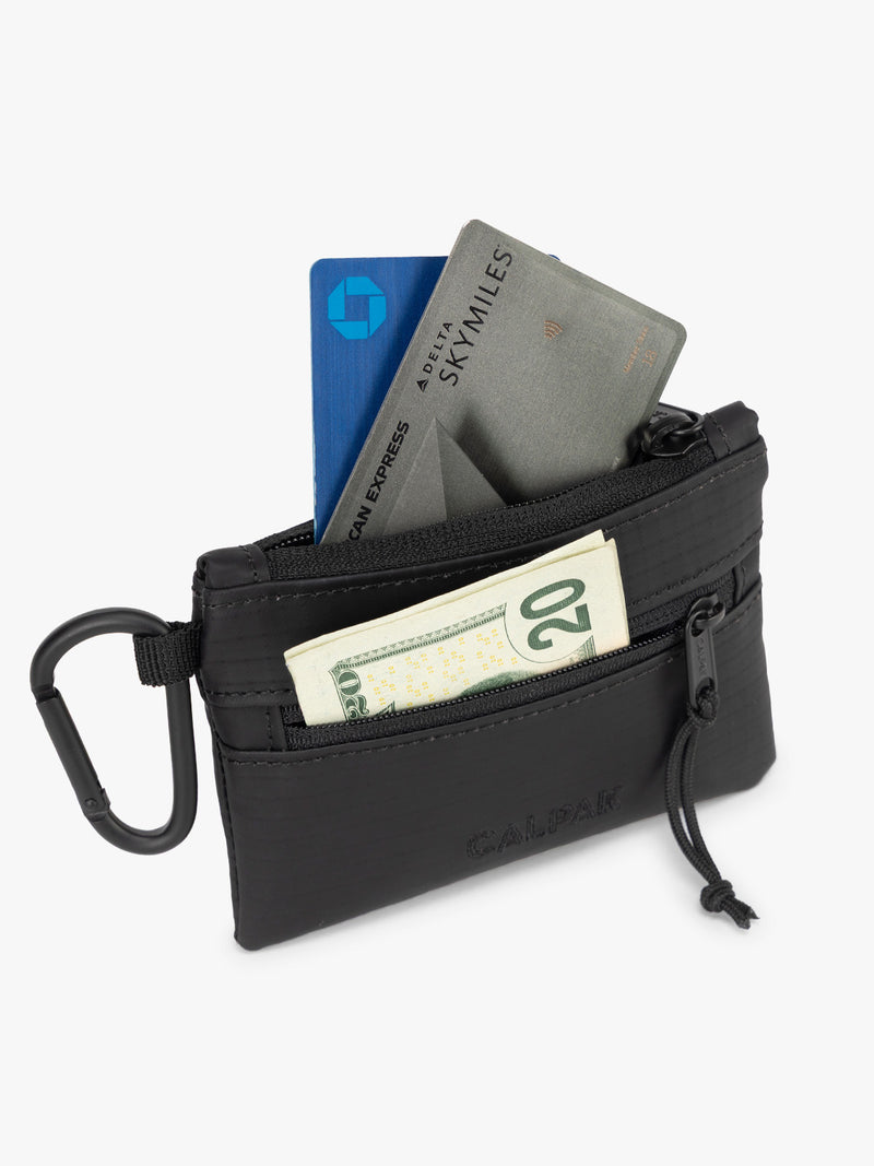 CALPAK Terra Clippable Card Pouch in black Matte Obsidian filled with cards and cash