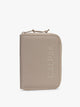 CALPAK Terra Zippered Passport Wallet in beige Stone front view; ATPW2501-STONE