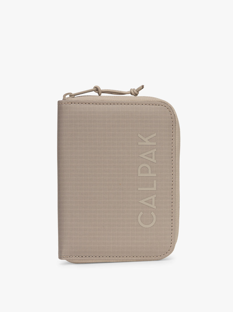 CALPAK Terra Zippered Passport Wallet in beige Stone front view