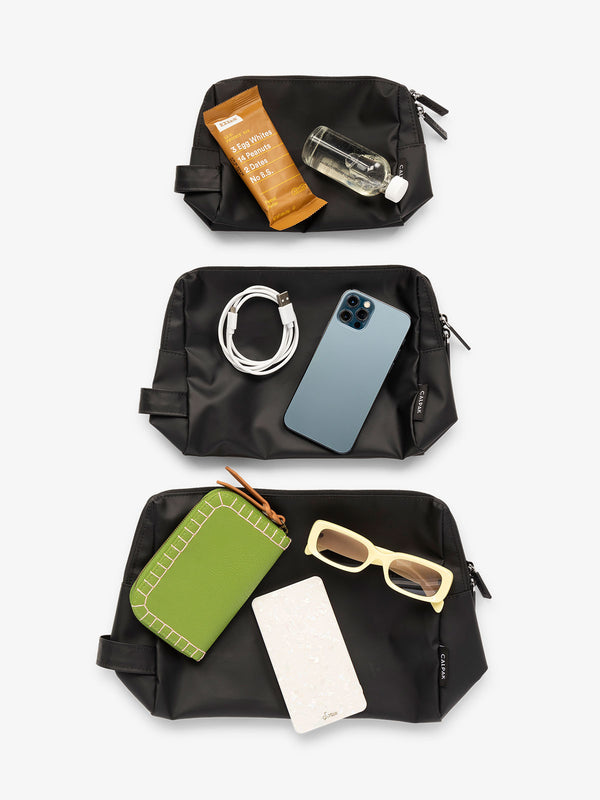 CALPAK waterproof zippered pouch set in size small, medium, and large in black
