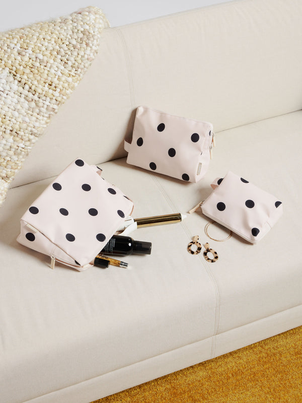 CALPAK water resistant zippered pouches for storing belongings in black and white polka dot
