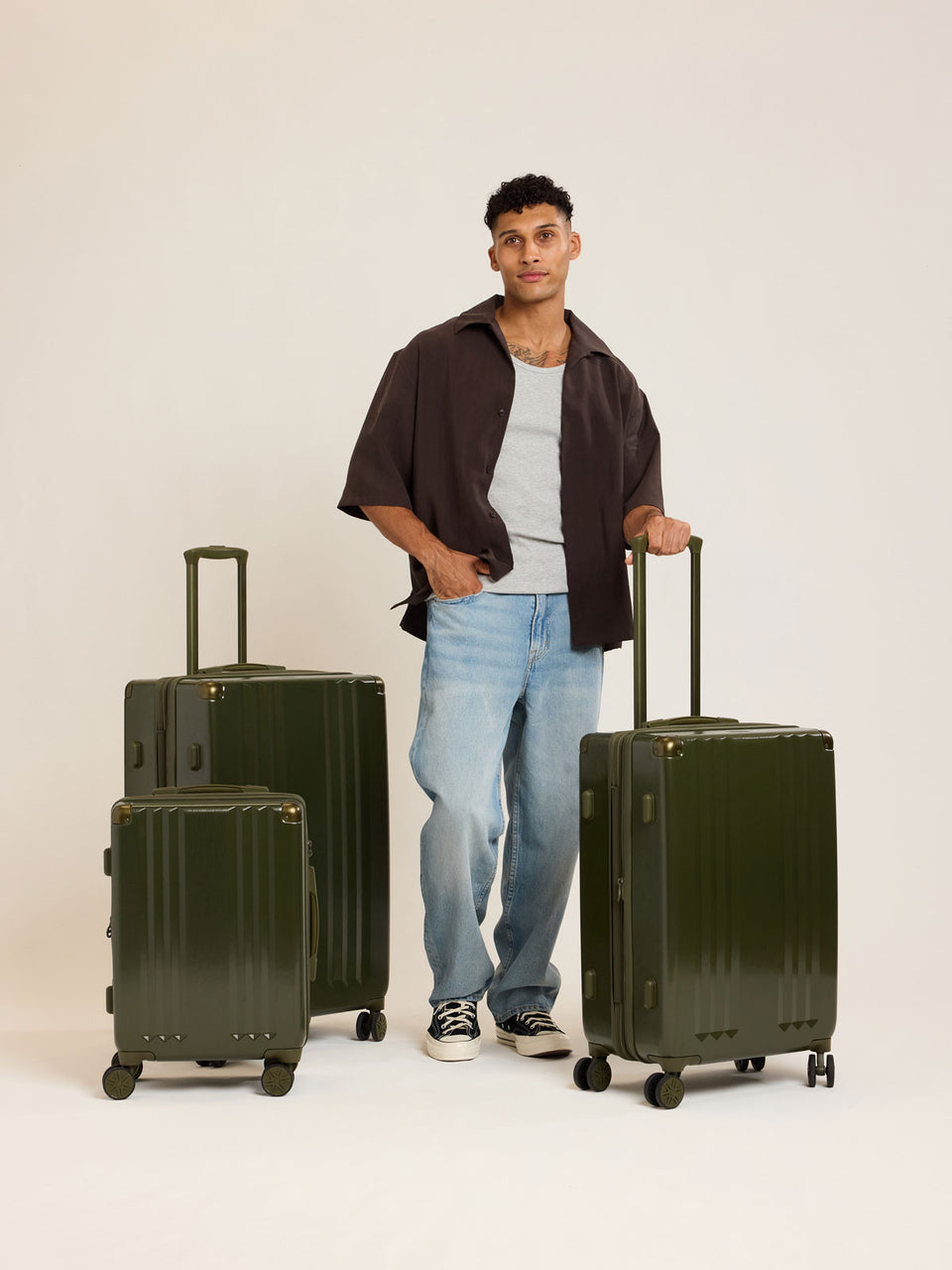 Model with CALPAK Ambeur 3pc dark green Pine Luggage Set; LAM3000-PINE