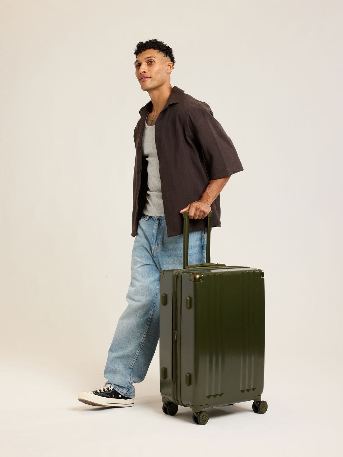 Model with CALPAK Ambeur Medium Luggage in dark green Pine; LAM1024-PINE