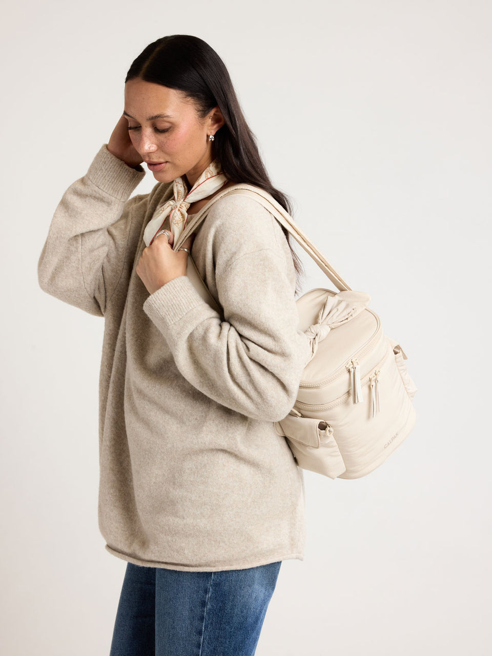 Woman wearing CALPAK Insulated Baby Bottle Bag in beige Oatmeal ; IBB2601-OATMEAL