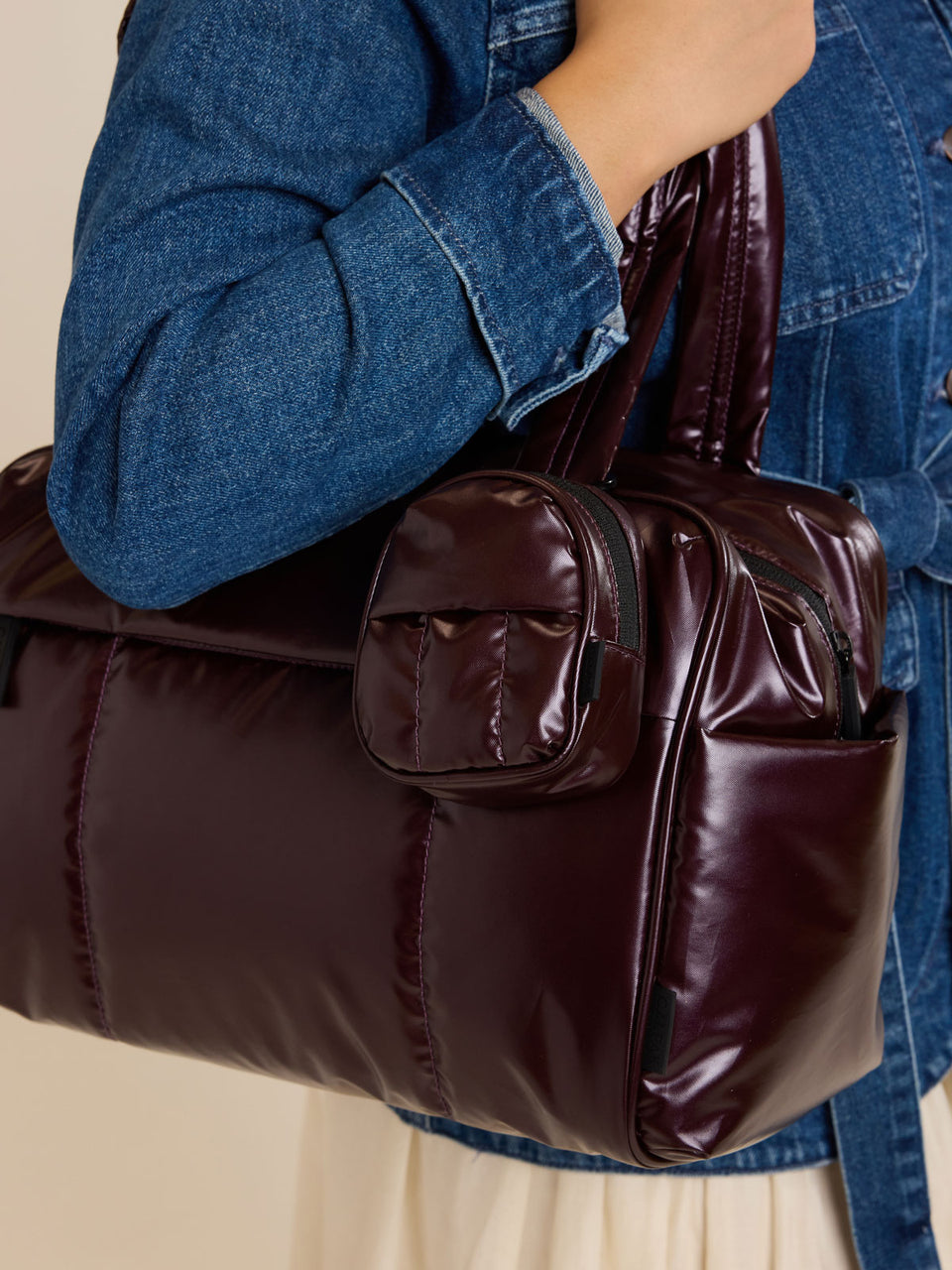CALPAK Luka Backpack Key Pouch in maroon Glazed Dark Cherry attached to a Luka Duffel; AMB2201-GLAZED-DARK-CHERRY