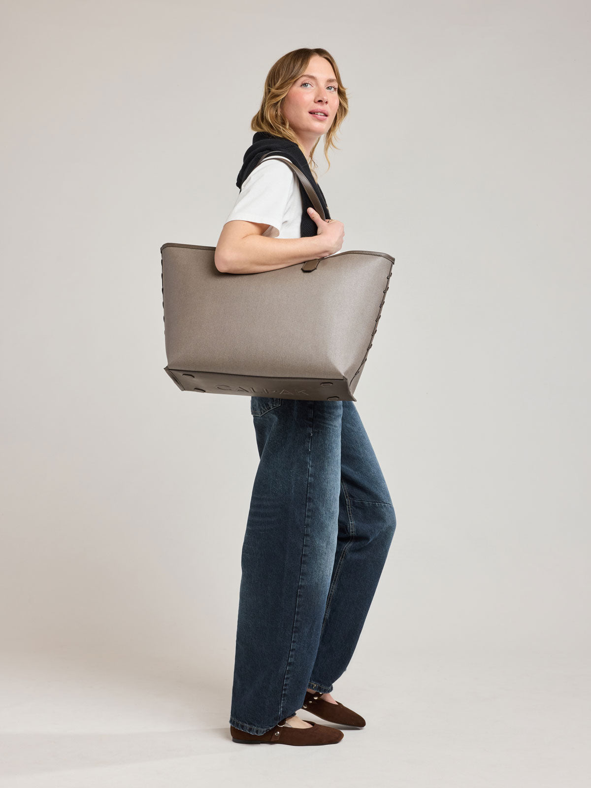 Model with CALPAK Colette 15" Canvas Laptop Tote in brown canvas material ; CLCT2601-MUSHROOM
