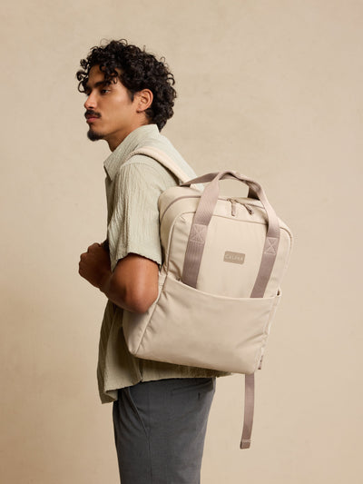 CALPAK Connect Laptop Backpack in grey beige Greige front view with a white background; BCN2401-GREIGE view 2