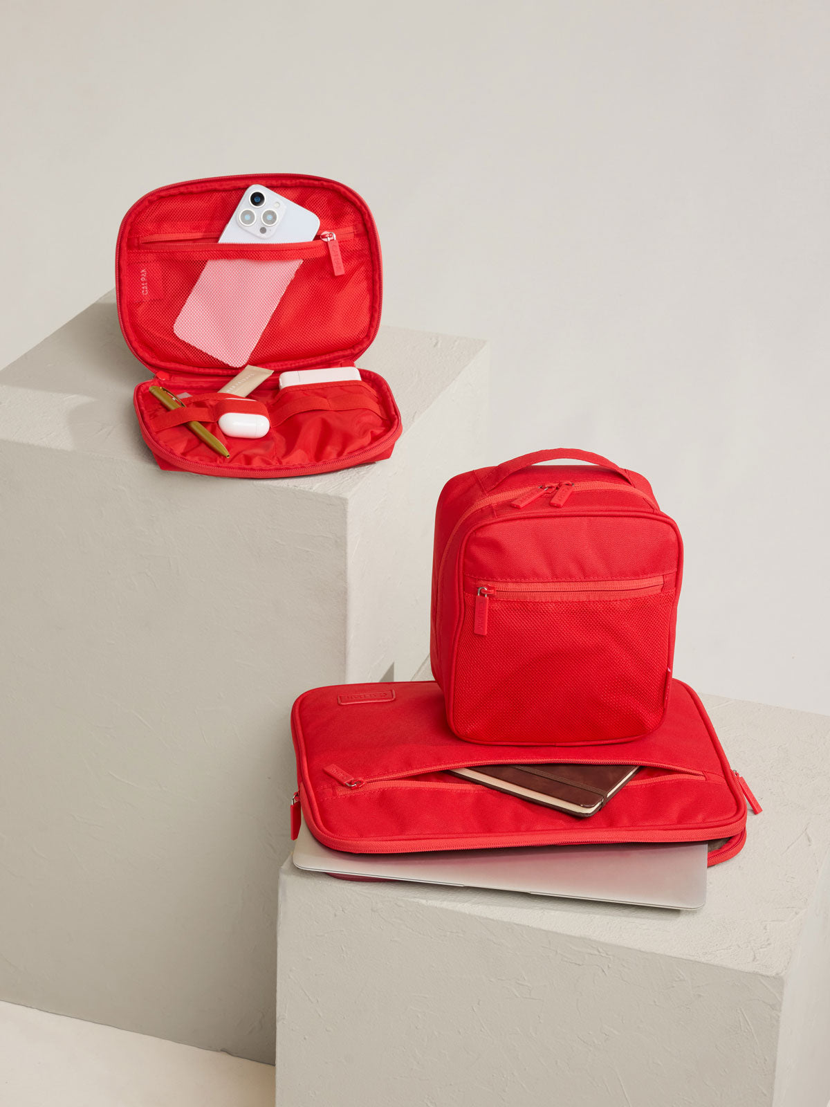 CALPAK Everything Cube in red Tomato on a stool; ACE2401-TOMATO