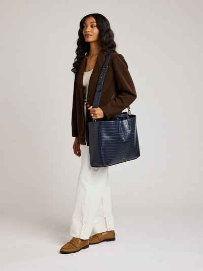 CALPAK Haven 16 Laptop Tote in blue Navy crocodile-embossed tote bag with top handles and a detachable shoulder strap, shown against a plain white background; ATO2102-NAVY-FAUX-CROC view 2