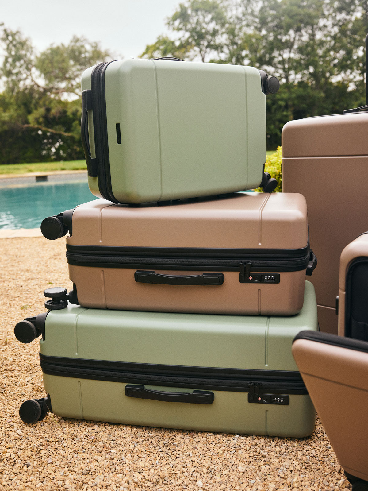 CALPAK Hue Large Luggage in green Juniper stacked with other Hue Luggages; LHU1028-JUNIPER