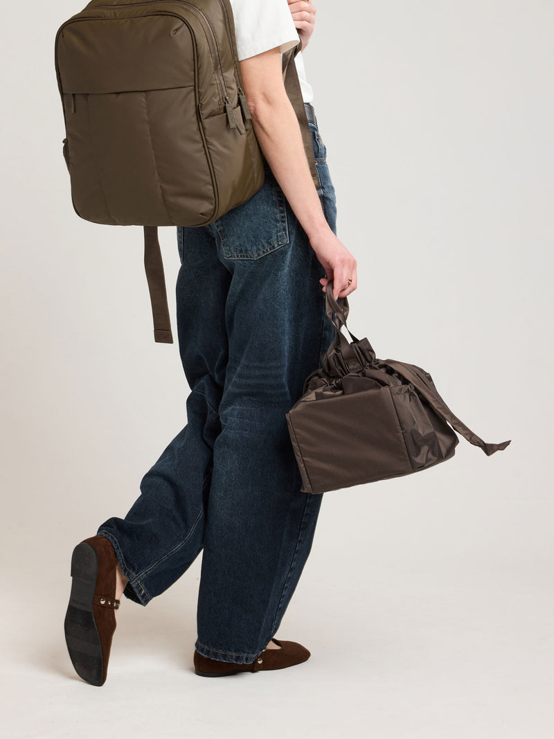 Person holding CALPAK Insulated Lunch bag brown Mushroom