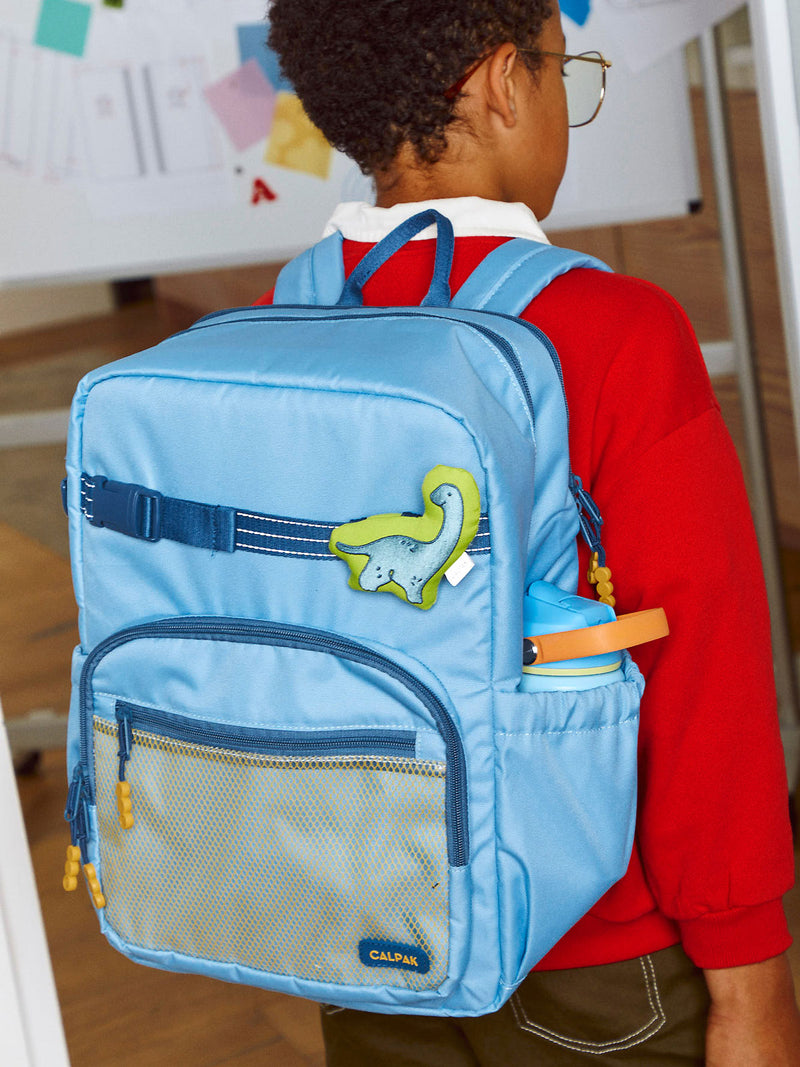 CALPAK Kids Large Backpack in Blue for ages 8-12 with Dinosaur Pluffy Bag Charm