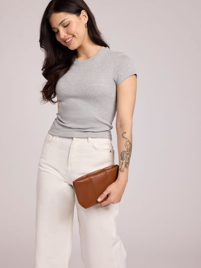  CALPAK Luka 1 quart light brown Honey Brown vegan leather pouch bag with a quilted, padded design and a small brand tag on the right side, shown against a plain white background; ZLPS2601-HONEY-BROWN-PU view 2