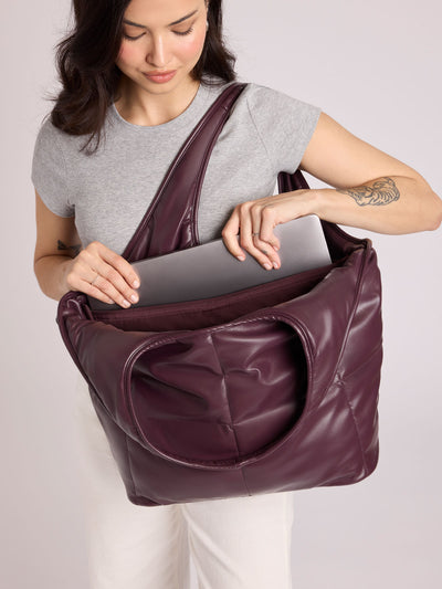 Dark Cherry quilted puffer CALPAK Luka Everything Tote Bag with a smooth finish and double shoulder straps, shown against a plain white background; AET2601-DARK-CHERRY-PU view 2