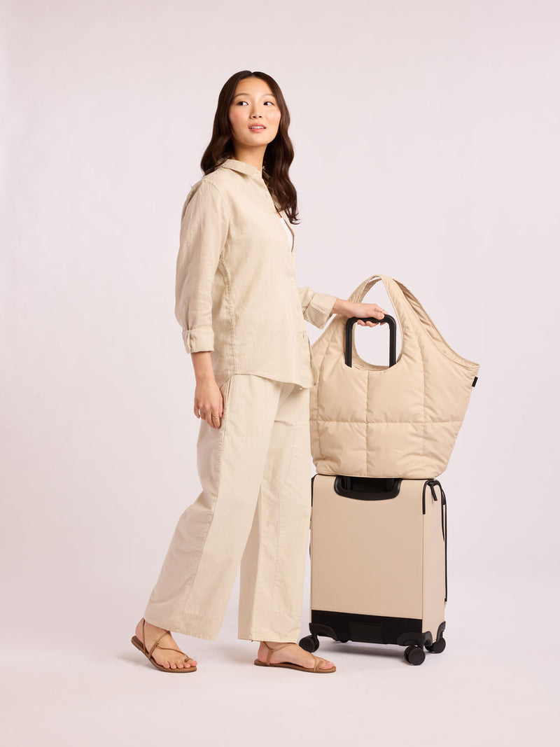 best travel tote bag with luggage sleeve Luka Everything Laptop Tote Bag in Oatmeal