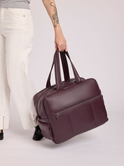 Dark Cherry deep burgundy CALPAK Luka Large Duffel in vegan leather with dual top handles, shown against a plain white background; DLL2201-DARK-CHERRY-PU view 2