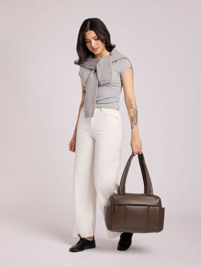Dark brown Mushroom vegan leather CALPAK Luka Mini Duffel with dual top handles and side pockets, photographed against a clean white background; DLM2501-MUSHROOM-PU view 2