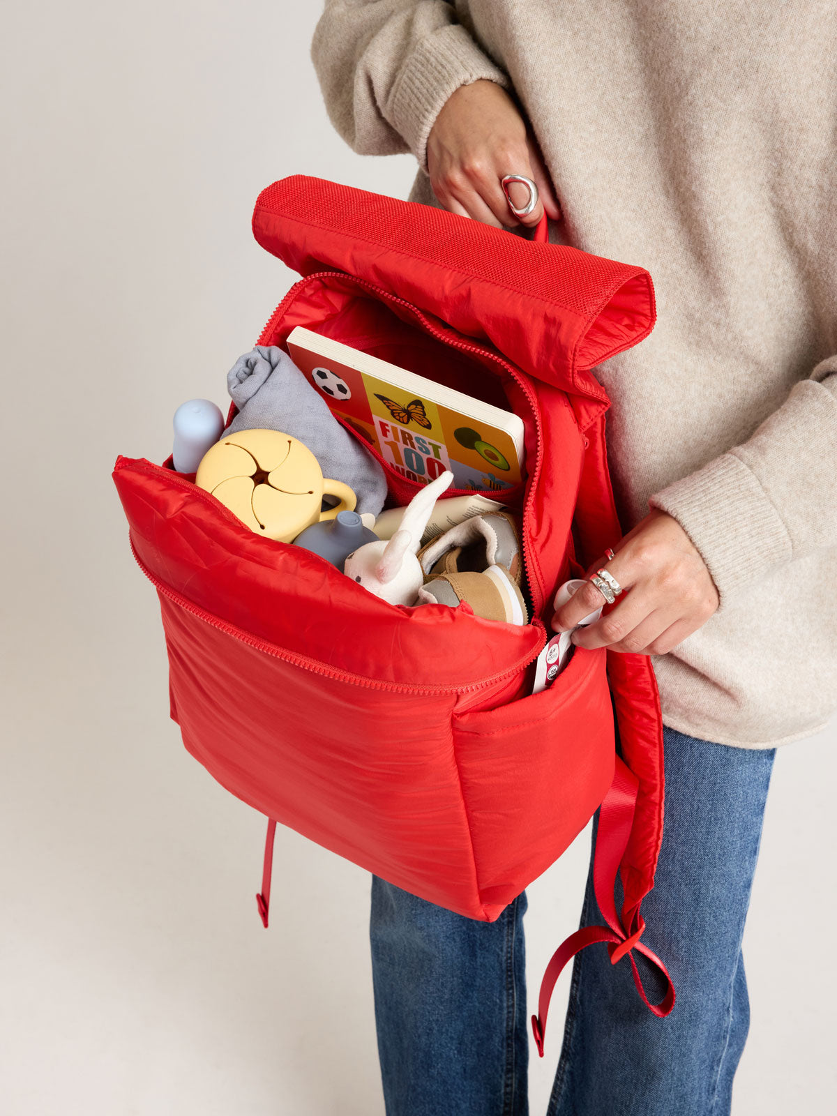 Baby items in CALPAK Mini Diaper Backpack in red Tomato; BPC2402-TOMATO