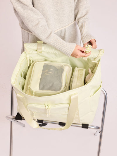 CALPAK Terra 35L Tote Bag with multiple pockets and shoulder straps in shiny light green Celadon on a white background; TTO2401-CELADON view 2
